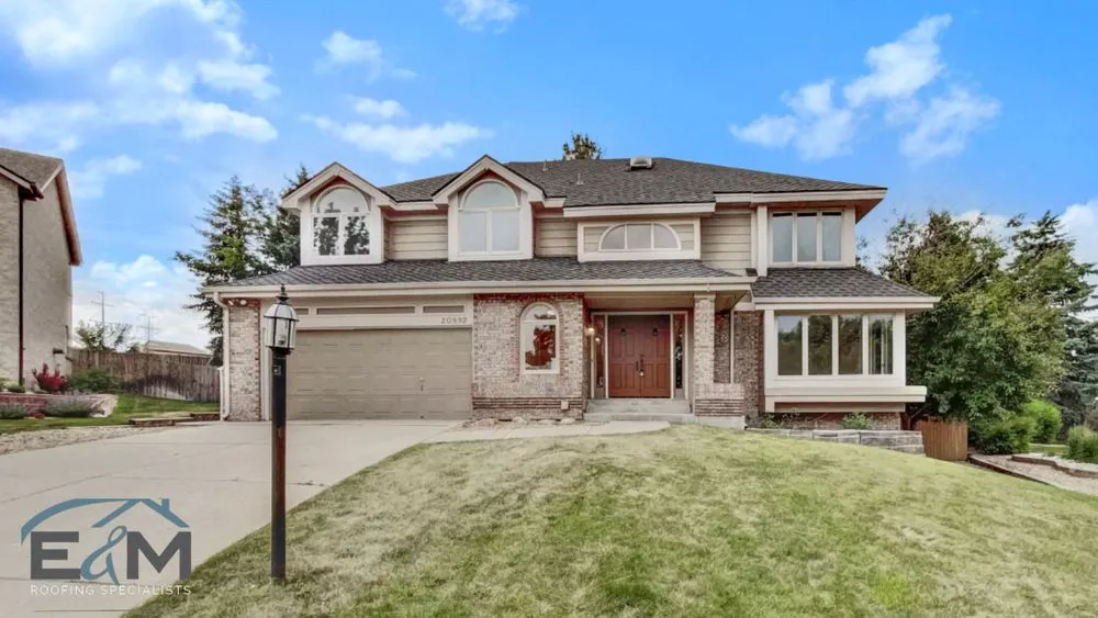 Slide of E&M Roofing Specialists