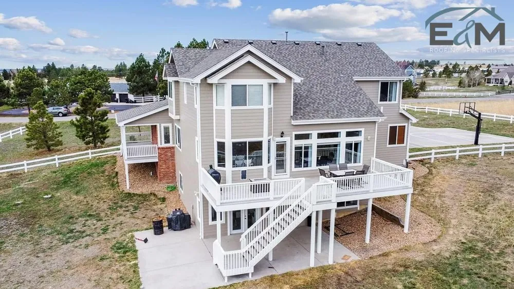 Slide of E&M Roofing Specialists