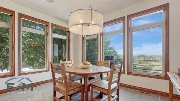 E&M Roofing Specialists Logo