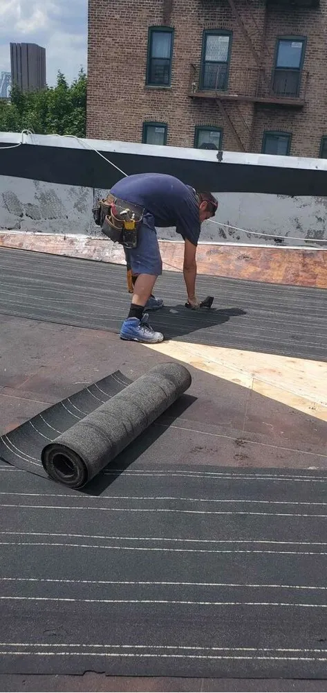 Slide of Empire State Roofing