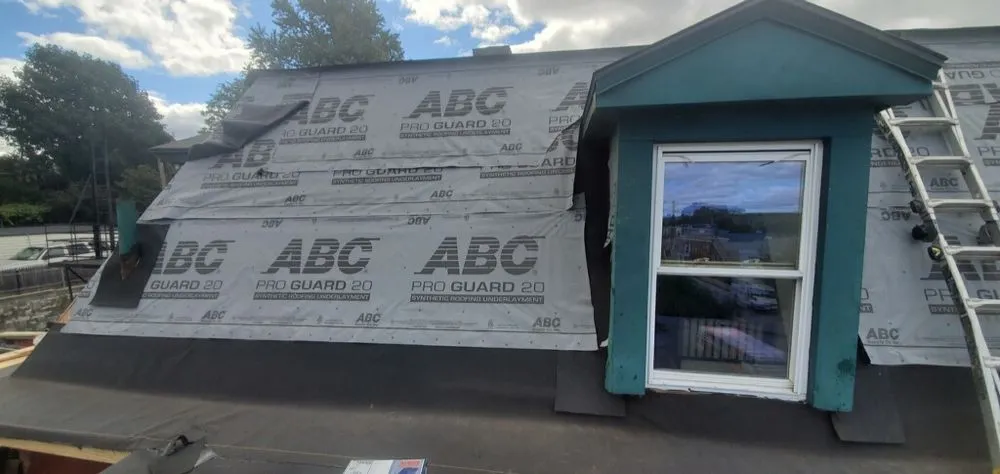 Slide of Empire State Roofing