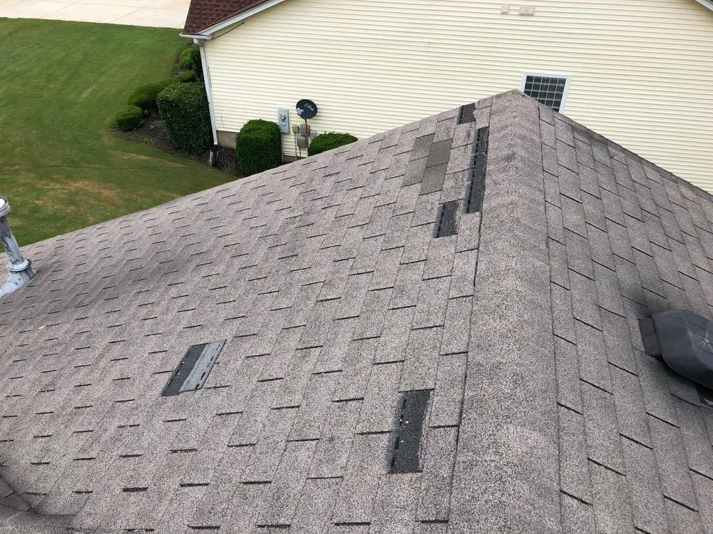 Slide of ER Roofing Specialist