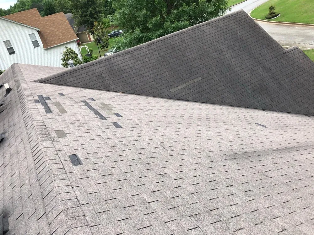 Slide of ER Roofing Specialist