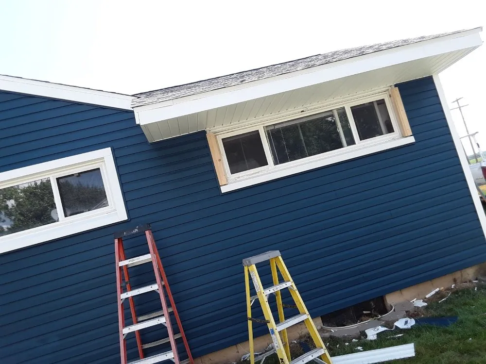 Slide of Erik Flinn roofing& construction