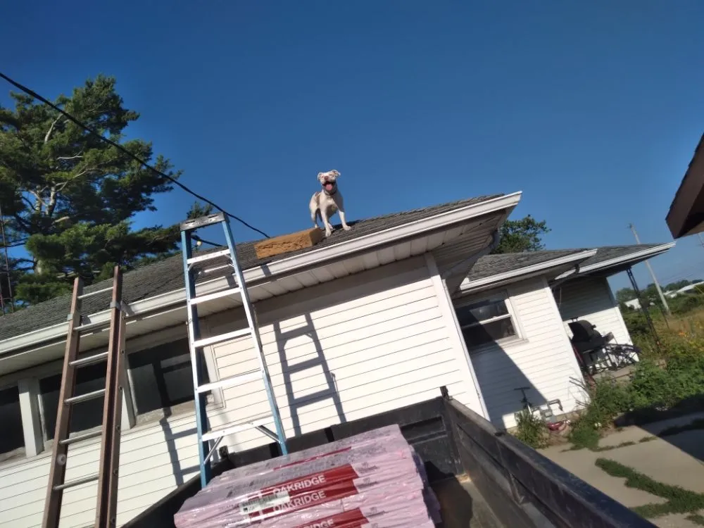 Slide of Erik Flinn roofing& construction