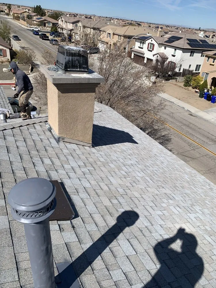 Slide of Ernestos Roofing