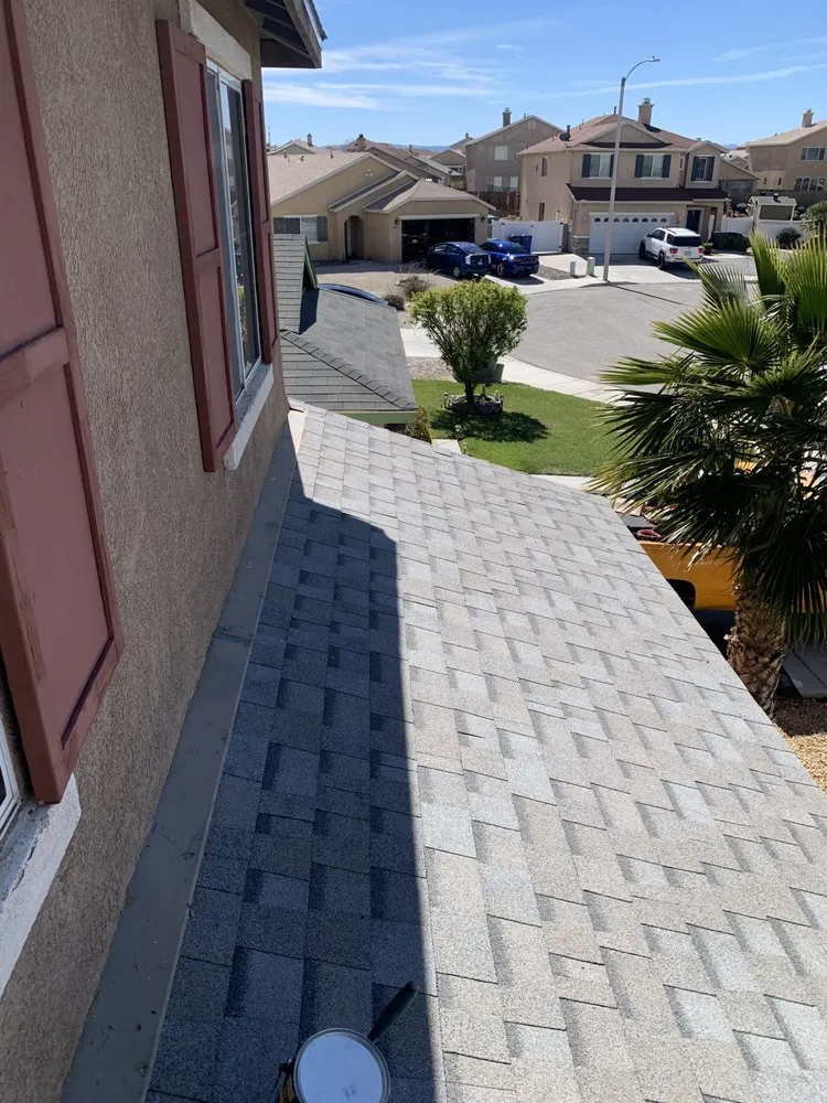 Slide of Ernestos Roofing