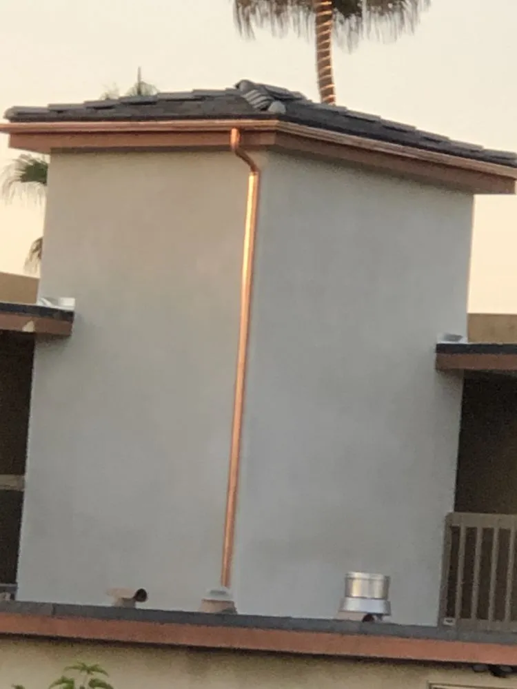 Slide of Escamilla’s Roofing and Rain Gutters