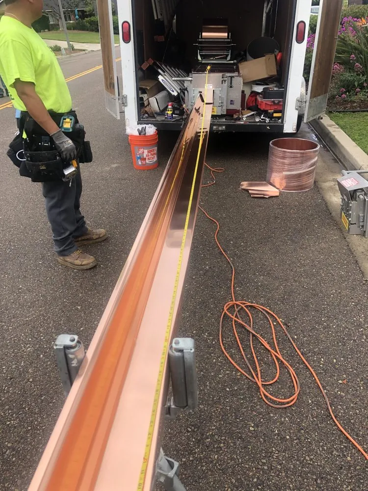 Slide of Escamilla’s Roofing and Rain Gutters