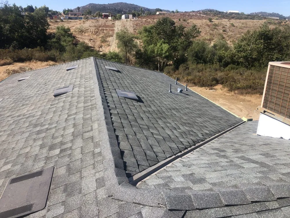 Slide of Escamilla’s Roofing and Rain Gutters