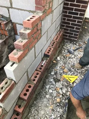 Essential masonaryand building Logo