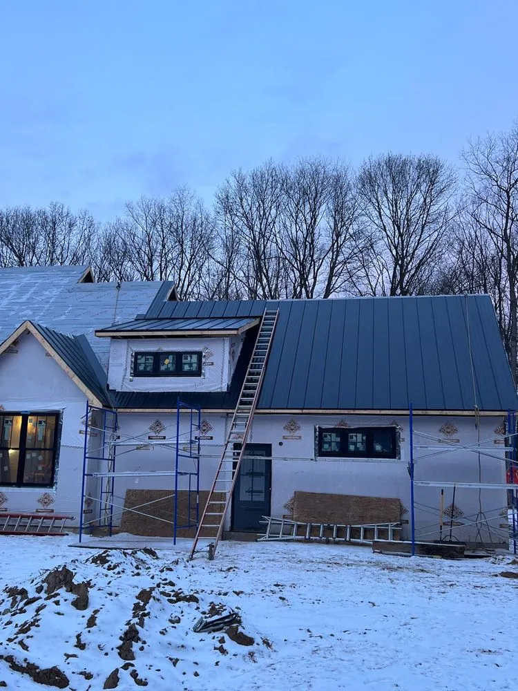 Slide of Esteban’s Roofing and Siding