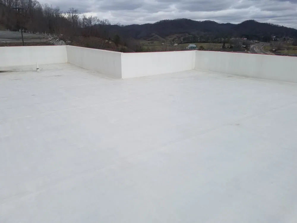 Slide of Estes and sons flat top roofing & repairs