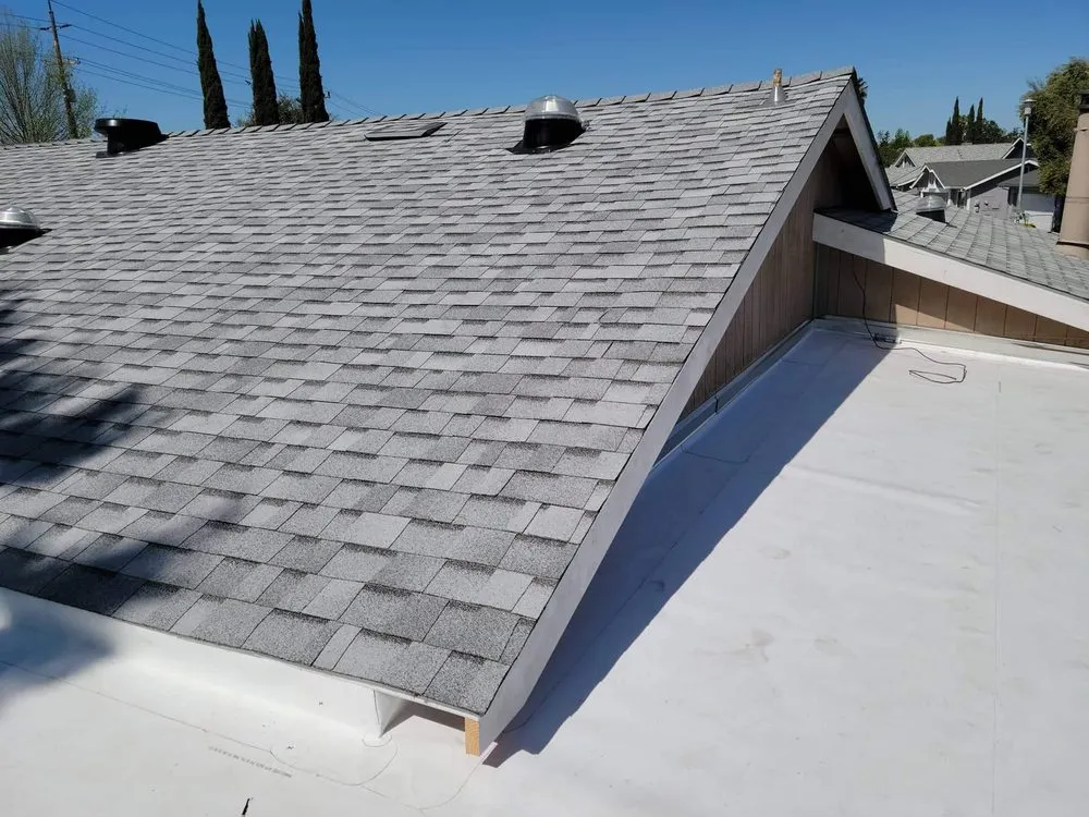 Slide of Everest Roofing