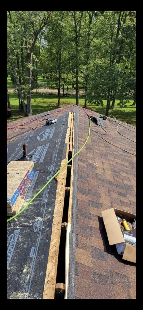 Slide of Excell Roofing