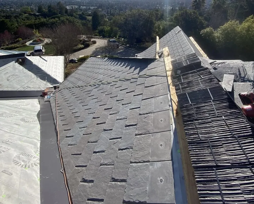 Slide of Exclusively Roofing