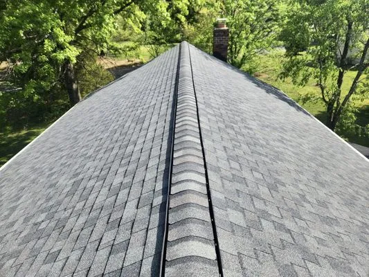 Exquisite Roofing and Exteriors Logo