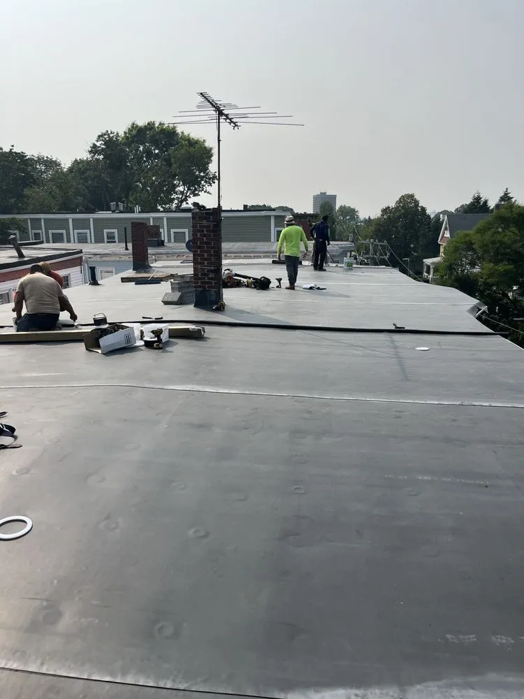 Expert residential roofing service after storm damage in Charlestown, MA by Exterior Remodelers