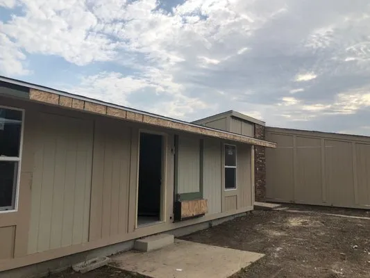 Exterior Tech Siding & Roofing Logo