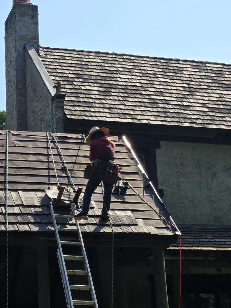 Slide of FAM Roofing