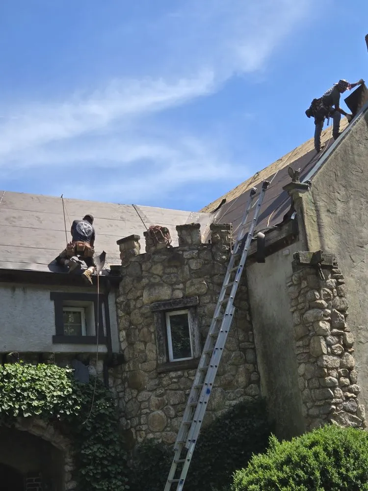 Slide of FAM Roofing