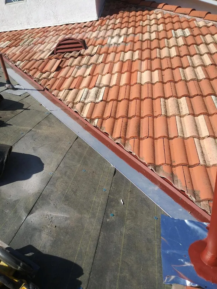 Slide of Father And Son Roofing.