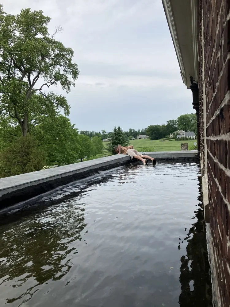 Slide of Feathers Roofing