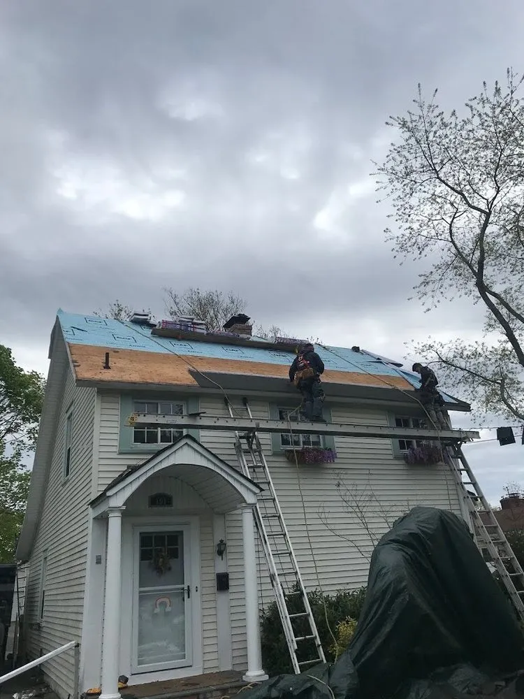 Slide of Five Boroughs Roofing