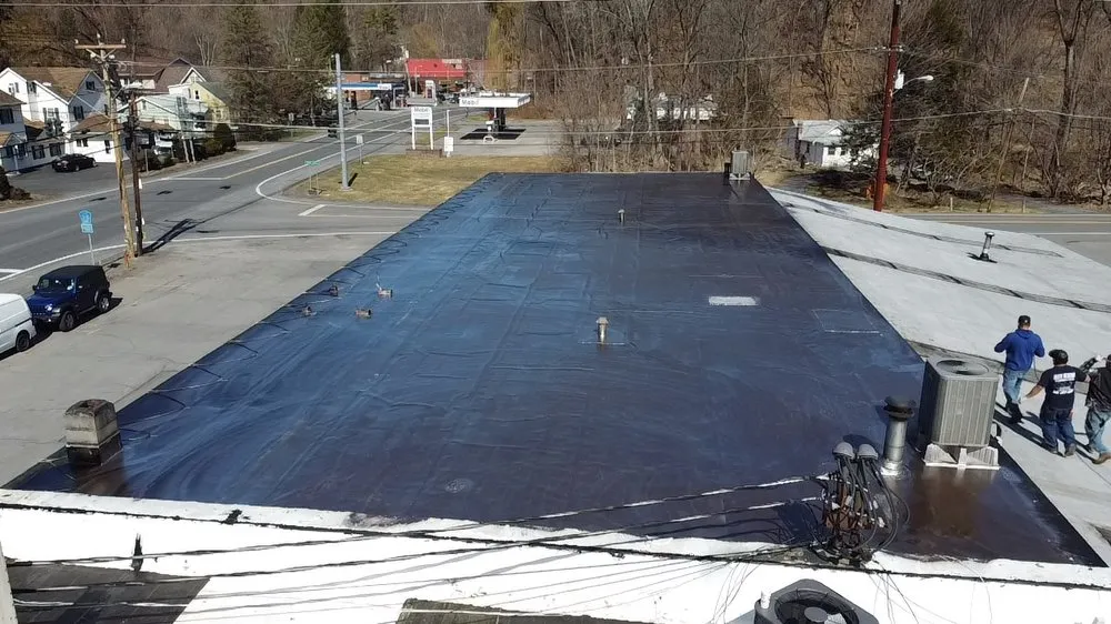 Slide of Five Boroughs Roofing