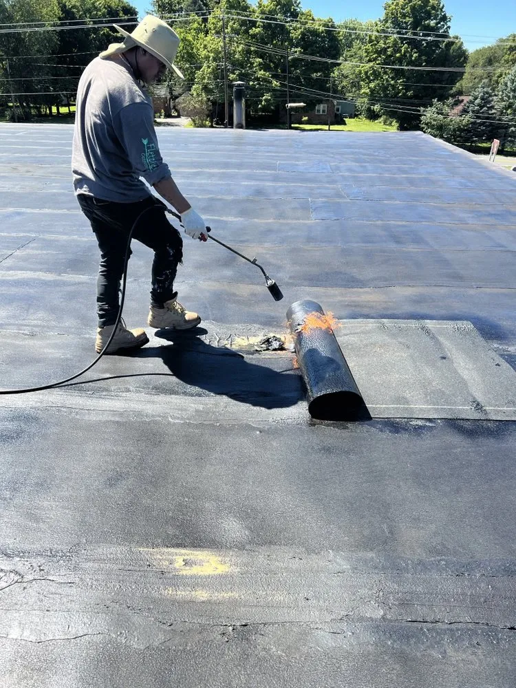 Slide of Five Boroughs Roofing