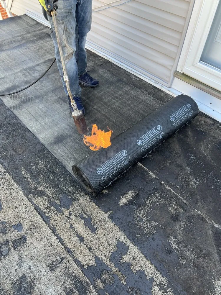 Slide of Five Boroughs Roofing