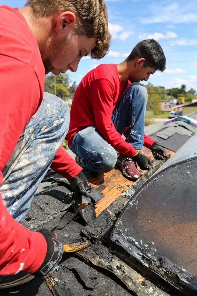 Slide of Five Guys Roofing