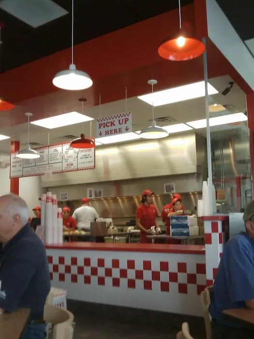 Slide of Five Guys Roofing