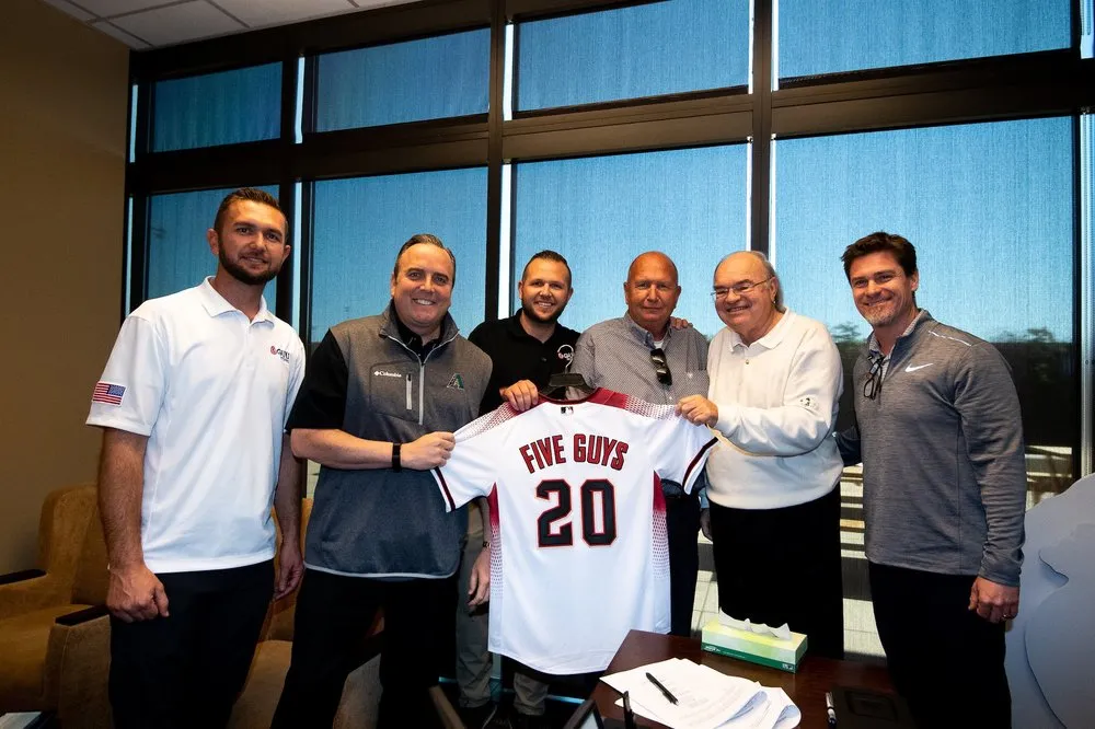 Slide of Five Guys Roofing