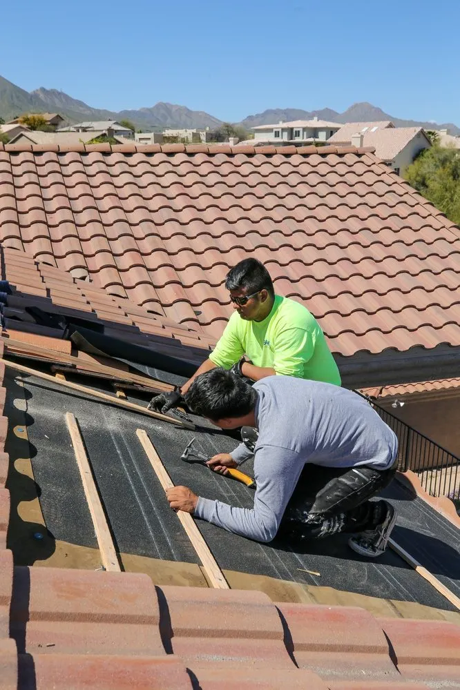 Slide of Five Guys Roofing