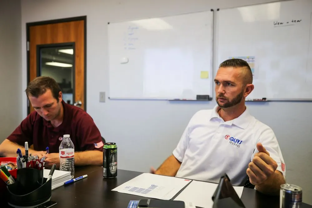 Slide of Five Guys Roofing