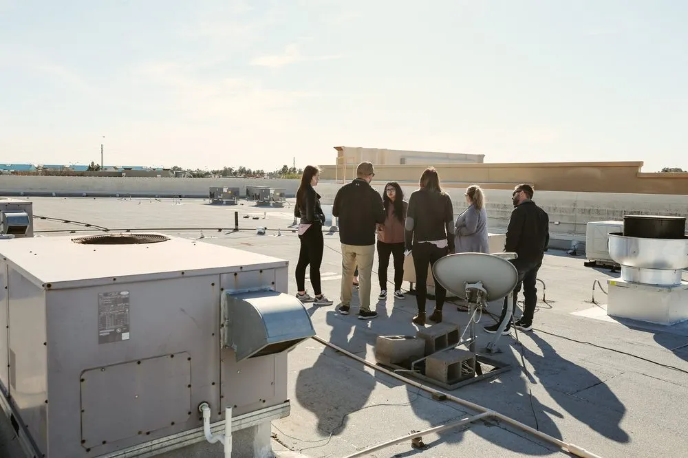 Slide of Five Guys Roofing