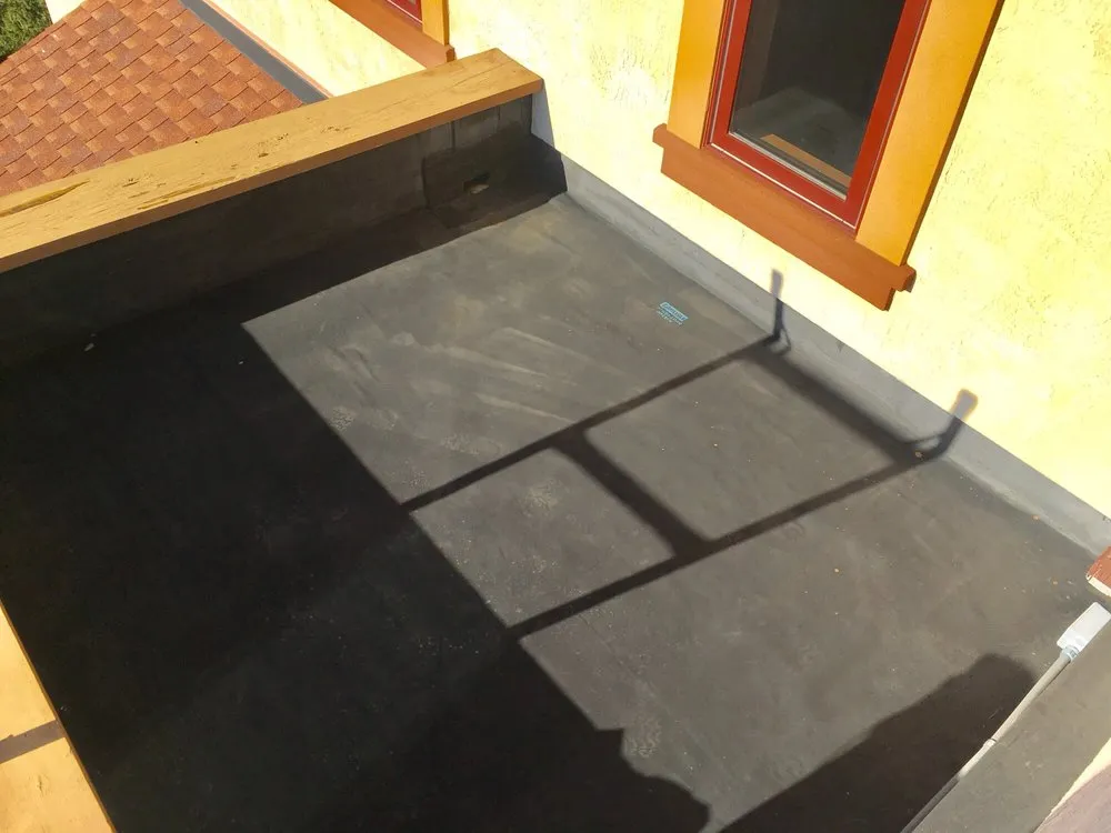 Slide of Flat Roof Pros