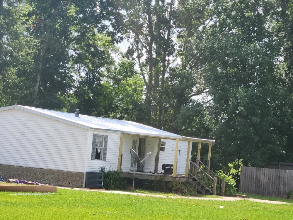 Licensed storm damage roof repair for homes in Clayton, LA by Flournoy and Sons Roofing