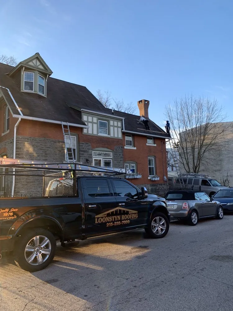 Slide of FM & Loonstyn Roofing