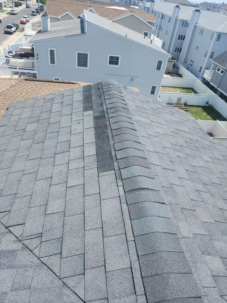 Slide of FM & Loonstyn Roofing