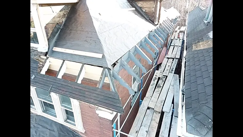 Slide of FM & Loonstyn Roofing