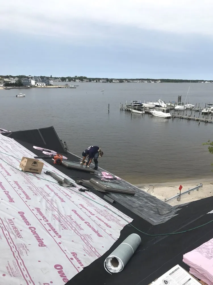 Slide of Four Brothers Roofing