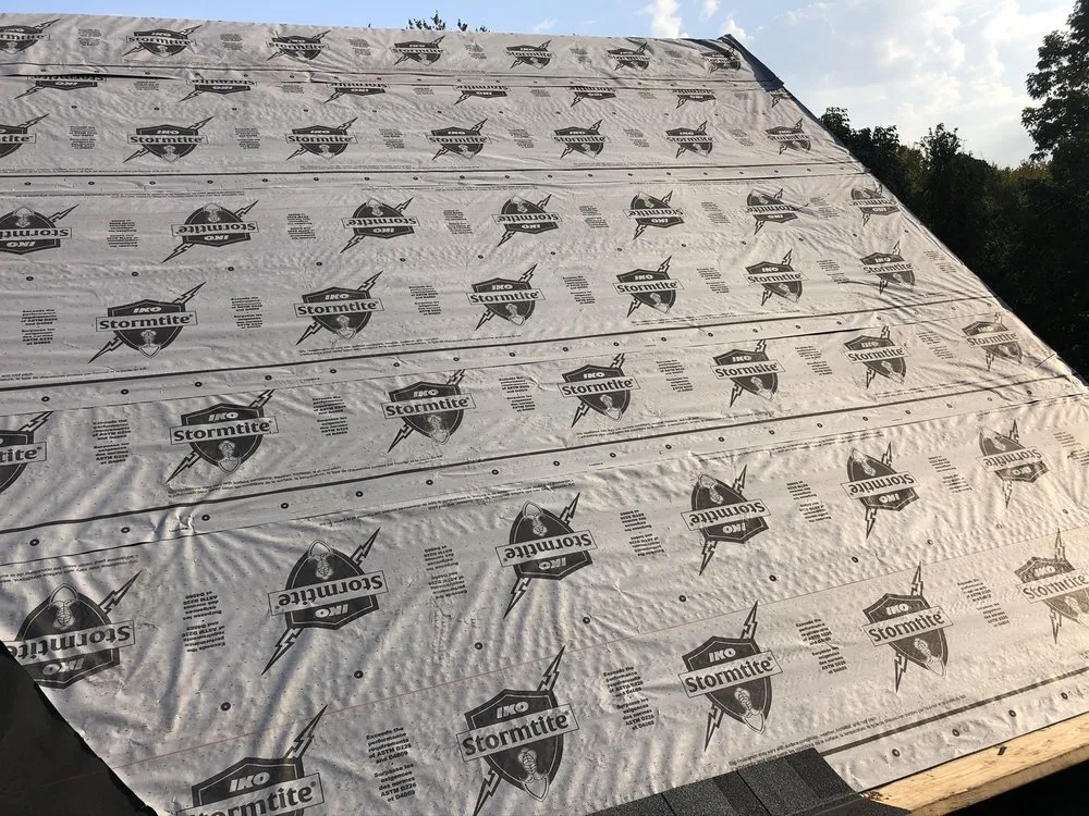 Slide of Four Brothers Roofing