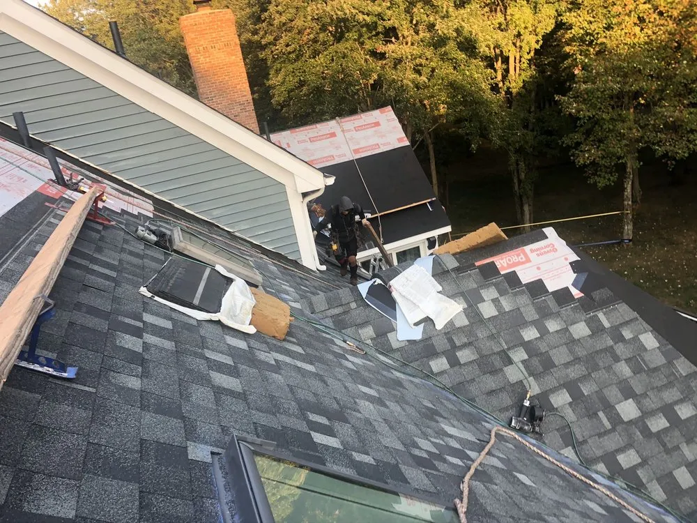 Slide of Four Brothers Roofing