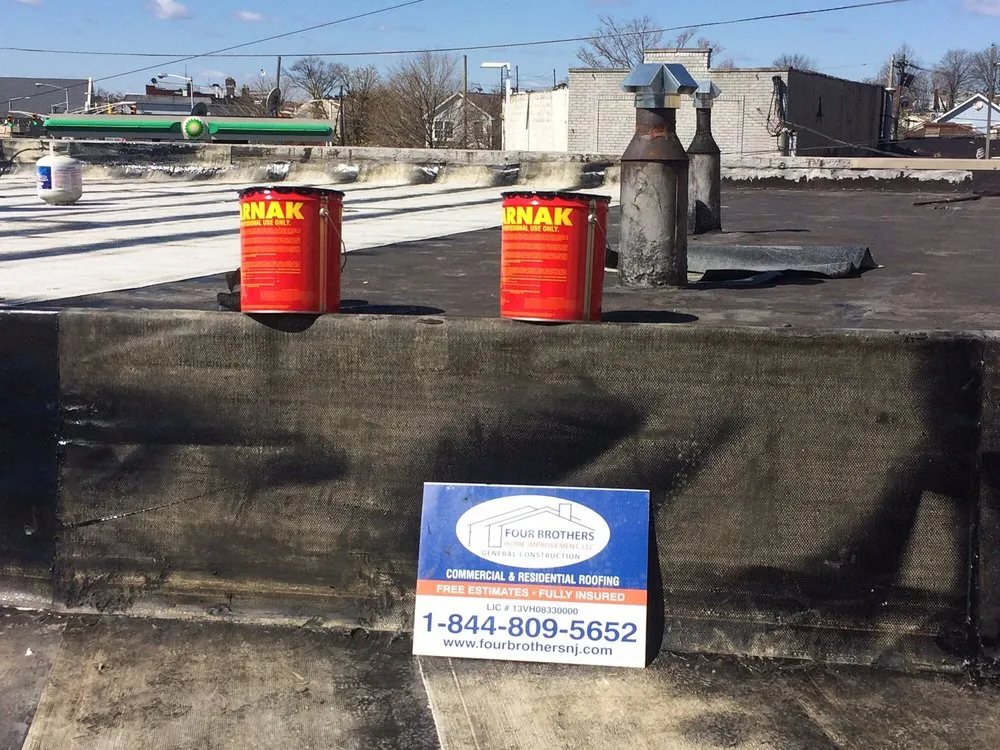 Slide of Four Brothers Roofing