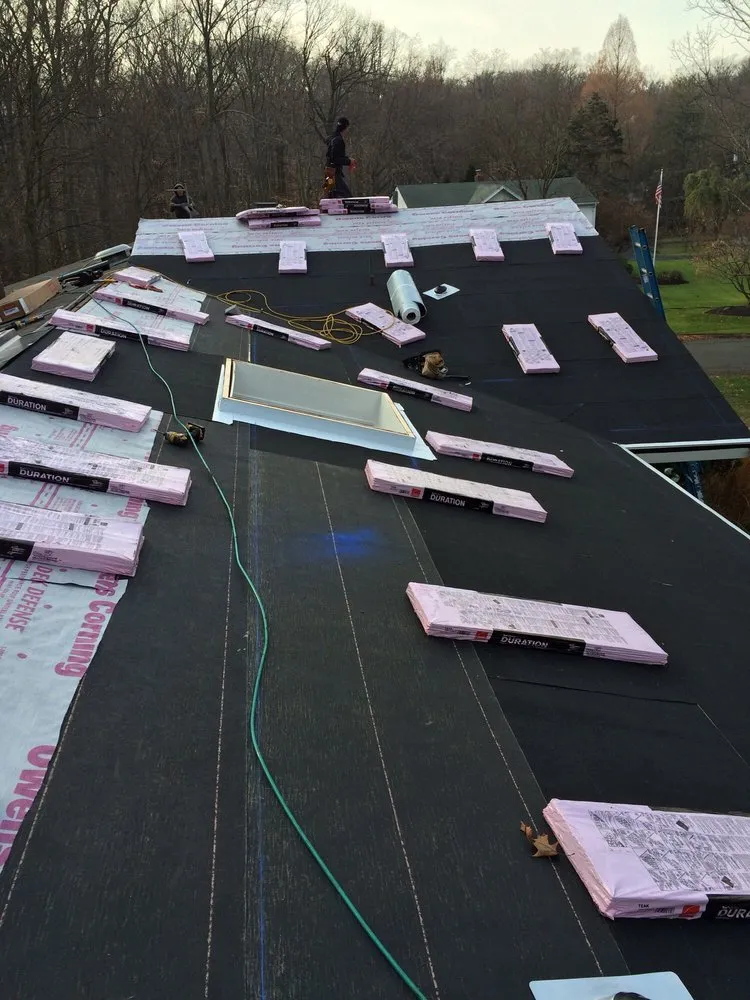 Slide of Four Brothers Roofing