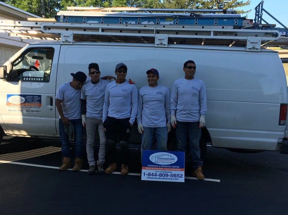 Slide of Four Brothers Roofing