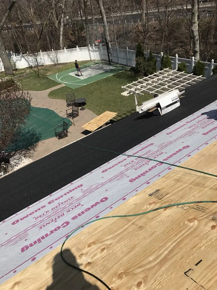 Slide of Four Brothers Roofing