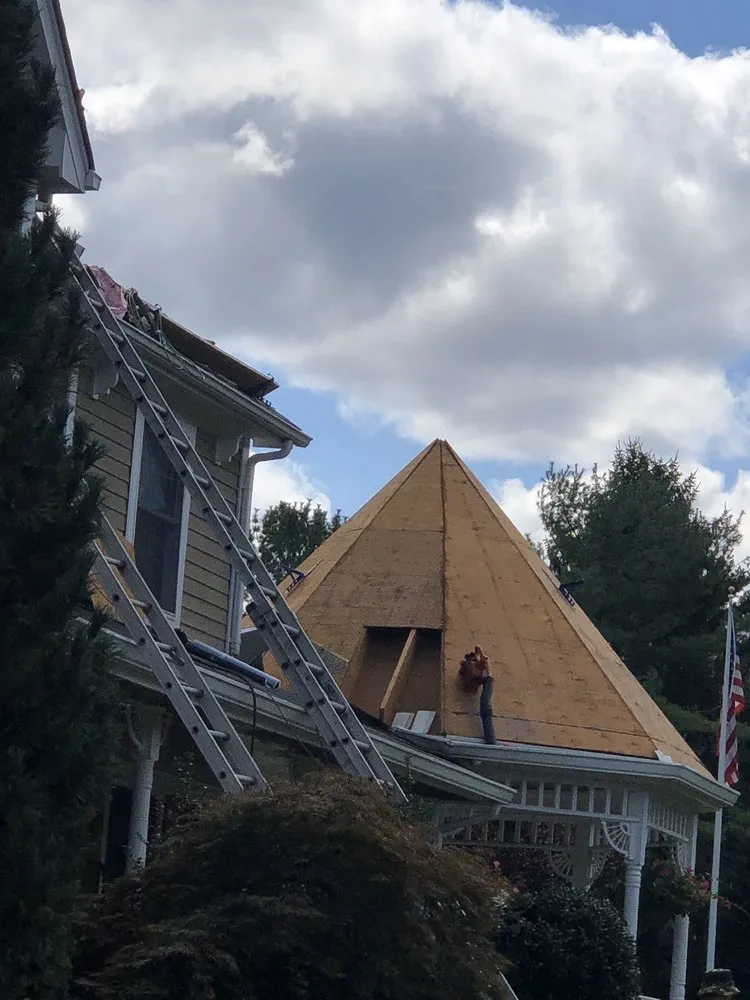 Slide of Four Brothers Roofing